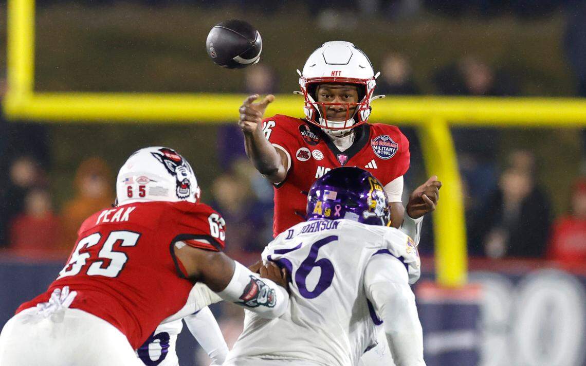 N.C. State quarterback CJ Bailey (16) passes the ball during the first half of N.C. State’s game against ECU in the Military Bowl at Navy-Marine Corps Memorial Stadium in Annapolis, Md., Saturday, Dec. 28, 2024.