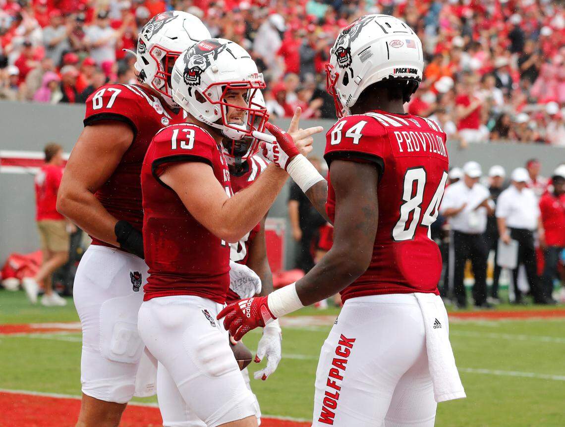 N.C. State wide receiver Jasiah Provillon (84) celebrates with quarterback Devin Leary (13) after Leary scored on a two-yard touchdown during the first half of N.C. State’s game against Charleston Southern at Carter-Finley Stadium in Raleigh, N.C., Saturday, Sept. 10, 2022.