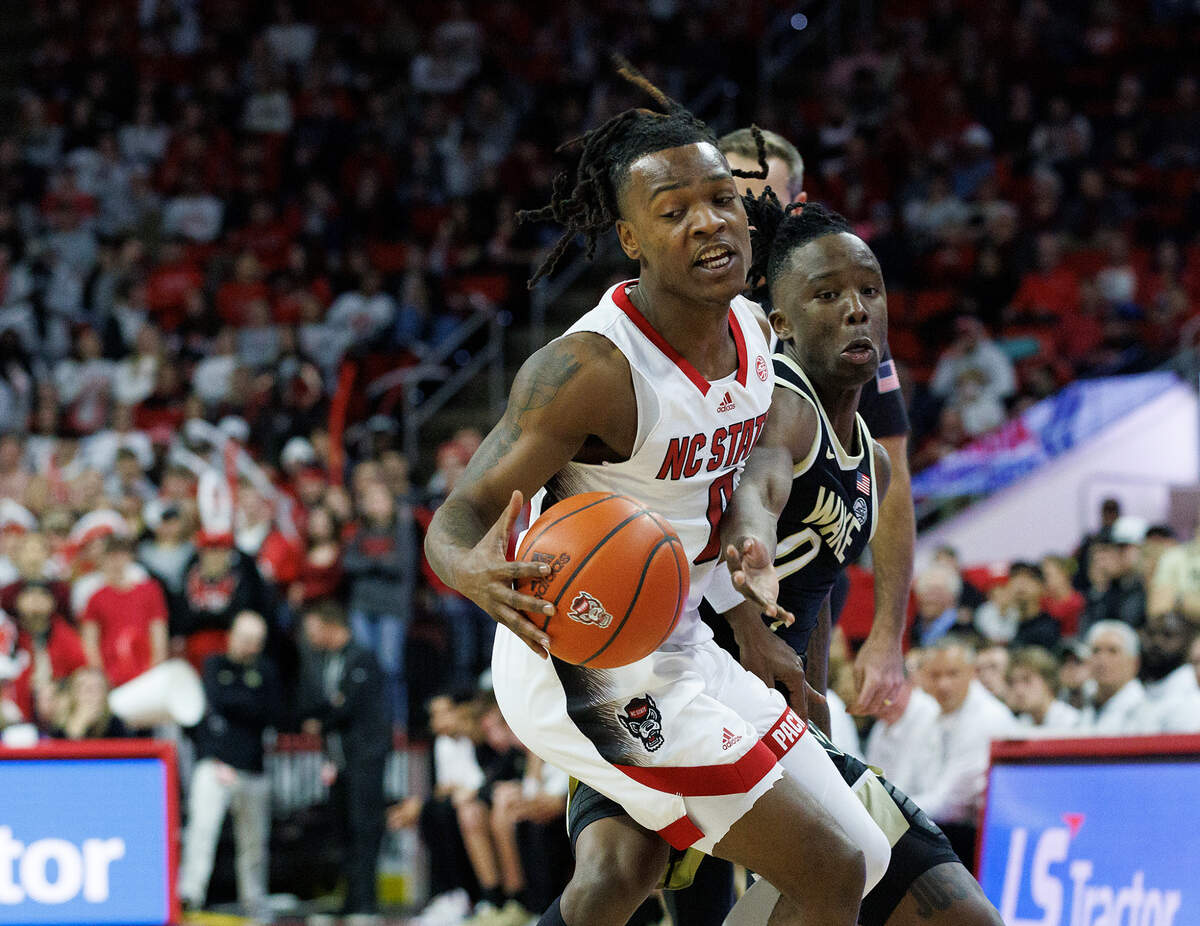 N.C. State’s DJ Horne is fouled by Wake Forest’s Kevin Miller during the second half of the Wolfpack’s 83-76 win at PNC Arena on Tuesday, Jan. 16, 2024, in Raleigh, N.C.