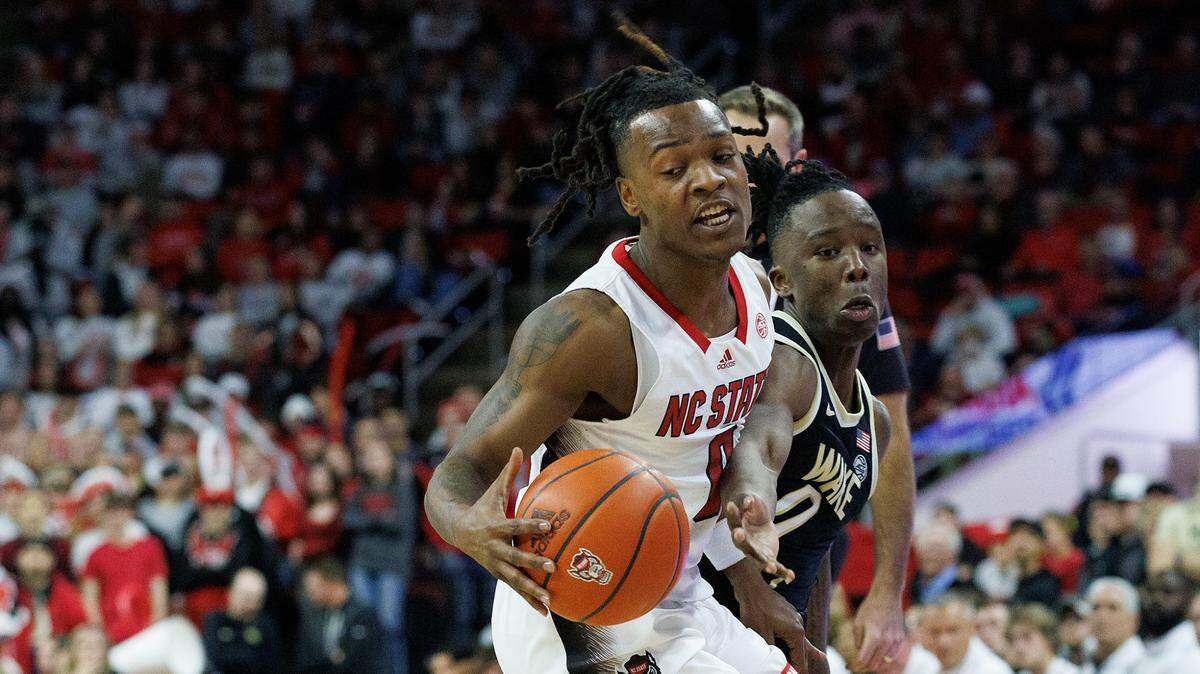 N.C. State’s DJ Horne is fouled by Wake Forest’s Kevin Miller during the second half of the Wolfpack’s 83-76 win at PNC Arena on Tuesday, Jan. 16, 2024, in Raleigh, N.C.