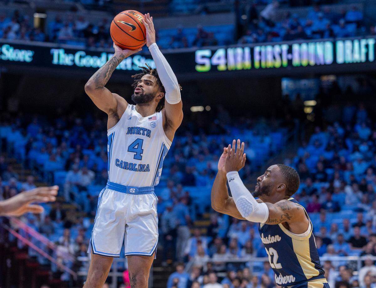 North Carolina’s R.J. Davis (4) puts up a shot over Charleston Southern’s R.J. Johnson (22) in the first half on Friday, December 29, 2023 at the Smith Center in Chapel Hill, N.C.