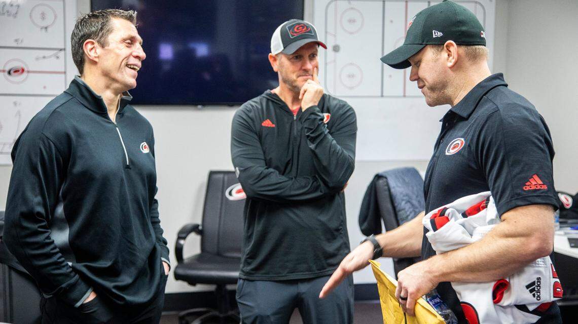 Emergency goalie Dave Ayres, 42, right, talks with Carolina Hurricanes coach Rod Brind’Amour, left, and owner Tom Dundon Tuesday, Feb. 25, 2020 while visiting Raleigh after helping the Hurricanes beat the Maple Leafs in Toronto.