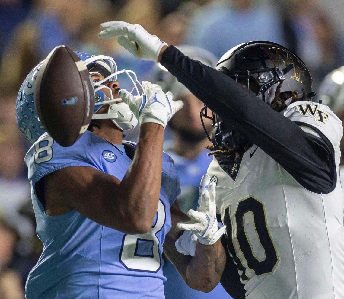 Wake Forest defensive back C’Darius Kelley (10) breaks up a pass intended for North Carolina wide receiver Kobe Paysour (8) in the fourth quarter on Saturday, November 16, 2024 at Kenan Stadium in Chapel Hill, N.C.