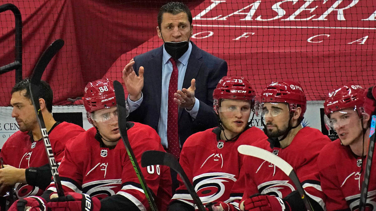 Carolina Hurricanes coach Rod Brind’Amour, shown in a March 2021 game, has received his first COVID-19 vaccination shot. (AP Photo/Gerry Broome)