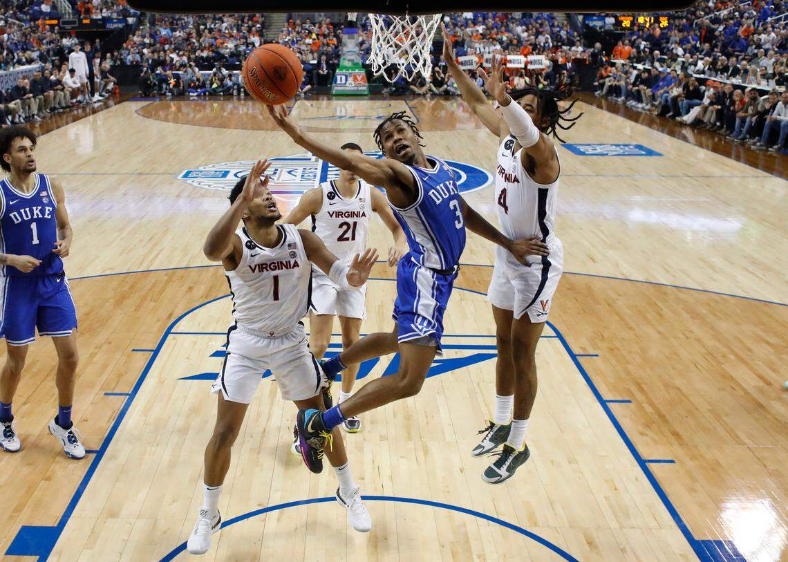 Duke’s Jeremy Roach (3) heads to the basket between Virginia’s Jayden Gardner (1) and Armaan Franklin (4) during Duke’s 59-49 victory over Virginia to win the ACC Men’s Basketball Tournament in Greensboro, N.C., Saturday, March 11, 2023.
