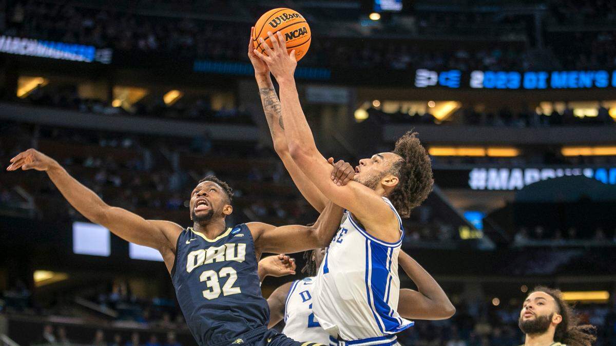 Duke’s Dereck Lively II (1) secures a defensive rebound over Oral Roberts’ Patrick Mwamba (32) during the first round of the NCAA Tournament on Thursday, March 16, 2023 at the Amway Center in Orlando, Fla.