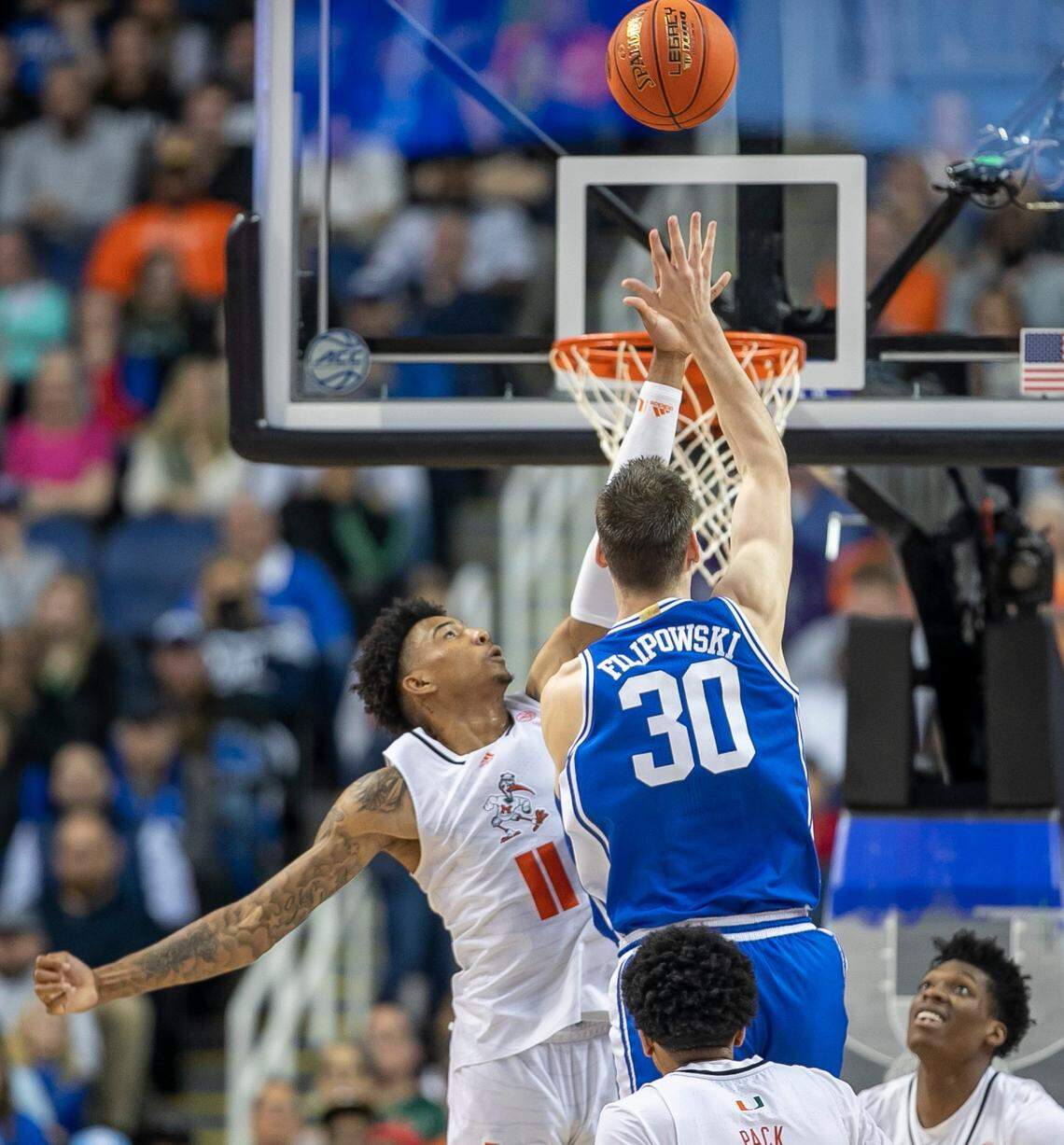 Duke’s Kyle Filipowski (30) puts up a shot against Miami’s Jordan Miller (11) in the second half during in the semi-finals of the ACC Tournament on Friday, March 10, 2023 at the Greensboro Coliseum in Greensboro, N.C.