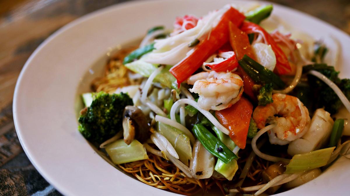 Yi Ge Asian Cuisine in Clayton serves a seafood fried noodle from its expansive Asian and Cantonese menu.