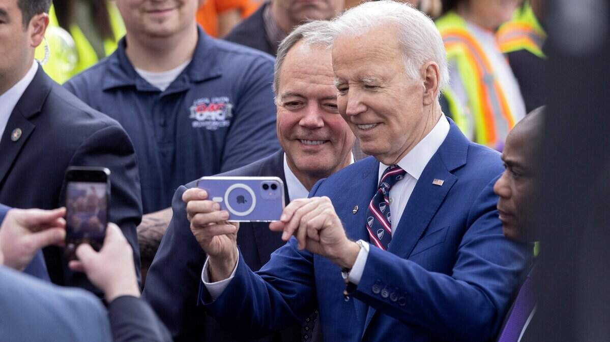 President Joe Biden takes a selfie with Wolfspeed CEO Gregg Lowe on Tuesday, March 28, 2023, in Durham, N.C.