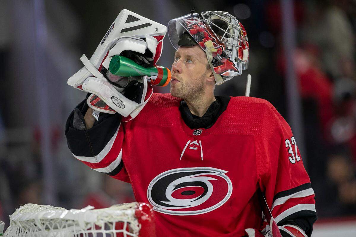 Carolina Hurricanes’ goalie Antii Raanta (32) hydrates during a time-out in the second period against New Jersey on Thursday, April 28, 2022 at PNC Arena in Raleigh, N.C.