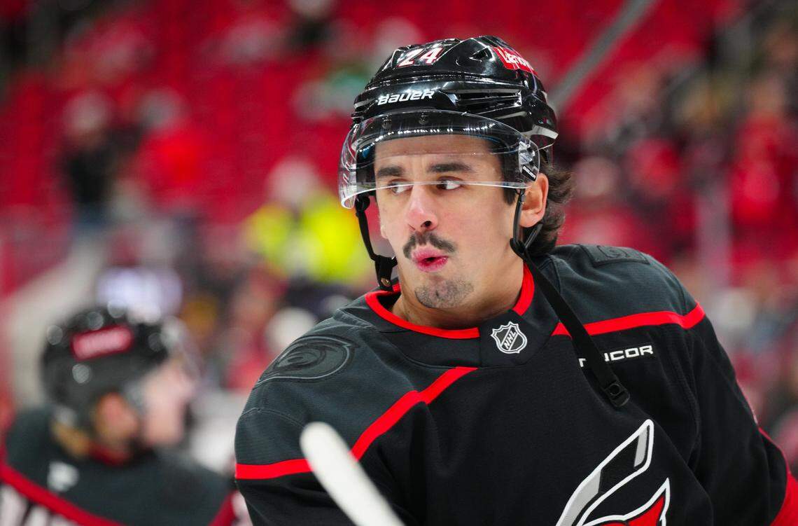 Dec 3, 2024; Raleigh, North Carolina, USA; aCarolina Hurricanes center Seth Jarvis (24) reacts during the warmups before the game against the Seattle Kraken t Lenovo Center. James Guillory-Imagn Images