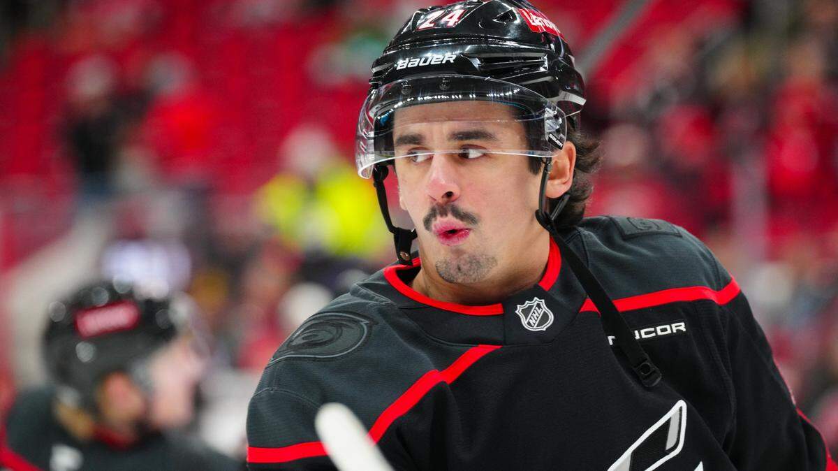 Dec 3, 2024; Raleigh, North Carolina, USA;  aCarolina Hurricanes center Seth Jarvis (24) reacts during the warmups before the game against the Seattle Kraken t Lenovo Center. James Guillory-Imagn Images
