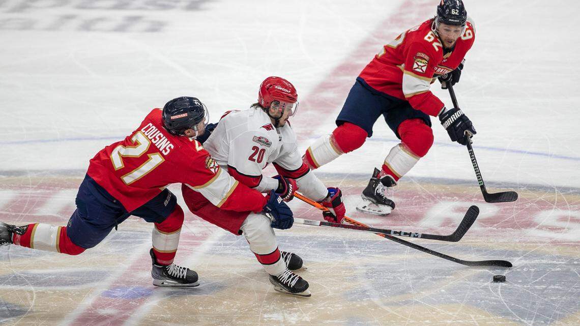 The Florida Panthers Nick Cousins (21) and Brandon Montour (62) work to slow the Carolina Hurricanes Sebastian Aho (20) in the first period of Game 3 of the Eastern Conference Finals on Monday, May 22, 2023 at FLA Live Arena in Sunrise, Fla.