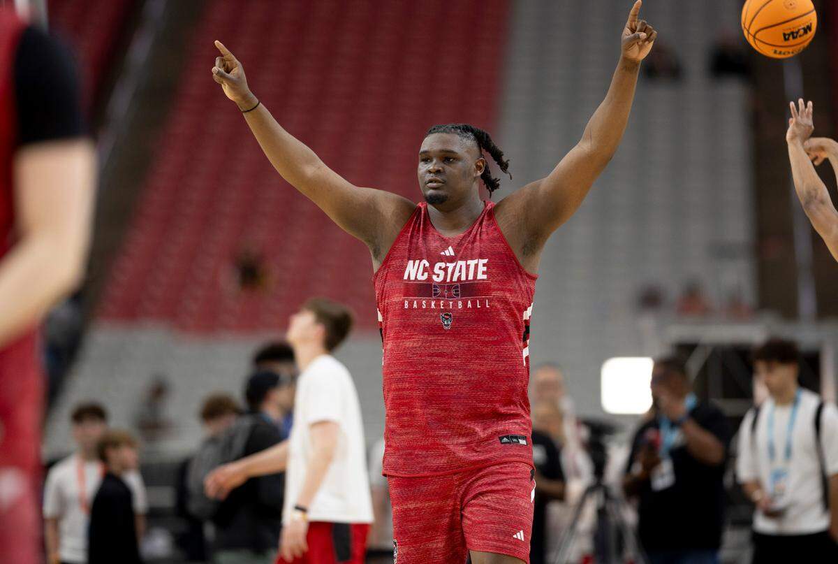N.C. State’s D.J. Burns Jr. (30) signals to teammates as they switch ends of the court during practice on Friday, April 5, 2024, as they prepare for their NCAA National Semi-Final game against Purdue at State Farm Stadium in Glendale, AZ.