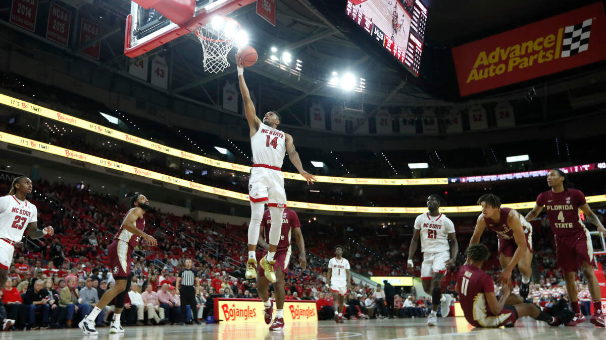 N.C. State’s Casey Morsell (14) scores during N.C. State’s 94-66 victory over FSU at PNC Arena in Raleigh, N.C., Wednesday, Feb. 1, 2023.