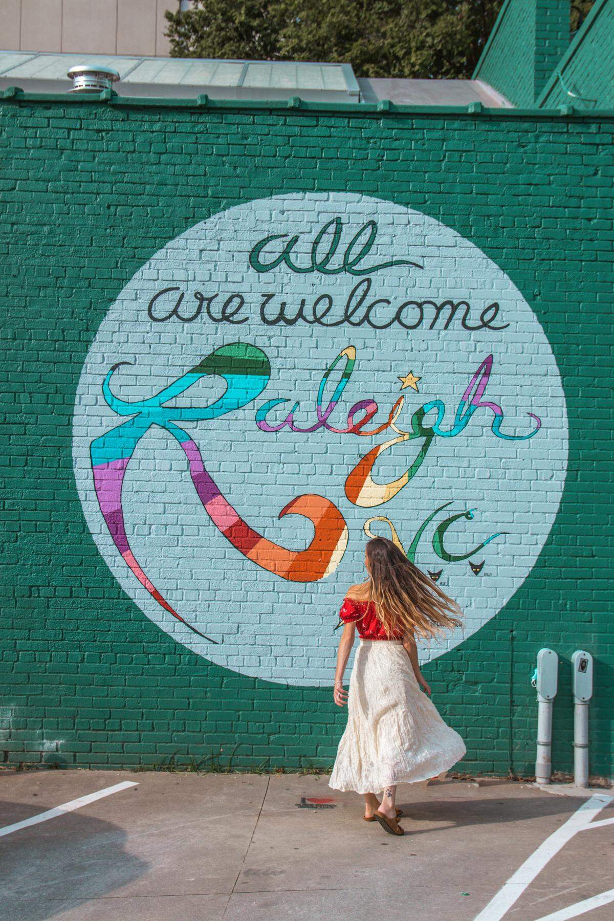 Luke Miller Buchanan’s “All Are Welcome” mural is a popular spot for Raleigh’s Instagrammers.