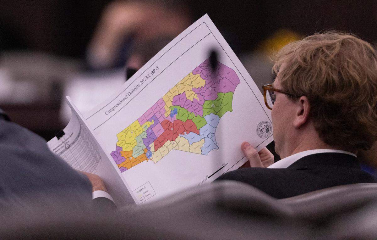 North Carolina state Sen.Benton Sawrey, a Johnston County Republican, looks at a proposed congressional map during a Senate Committee on Redistricting and Elections meeting at the Legislative Office Building in Raleigh, Thursday, October. 19, 2023.