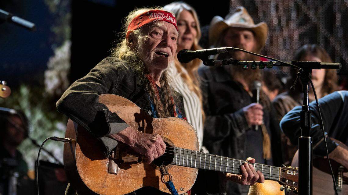 Willie Nelson is joined on stage by other performers for the finale at Farm Aid at Raleigh, N.C.’s Coastal Credit Union Music Park at Walnut Creek, Saturday, Sept. 24, 2022.
