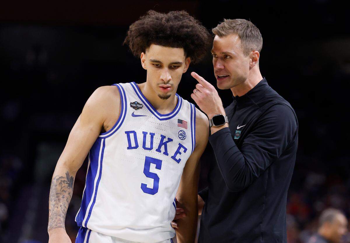 Duke head coach Jon Scheyer talks to Tyrese Proctor (5) during the second half of Houston’s 70-67 victory over Duke in the NCAA men’s national semifinal at the Alamodome in San Antonio, Texas, Saturday, April 5, 2025.