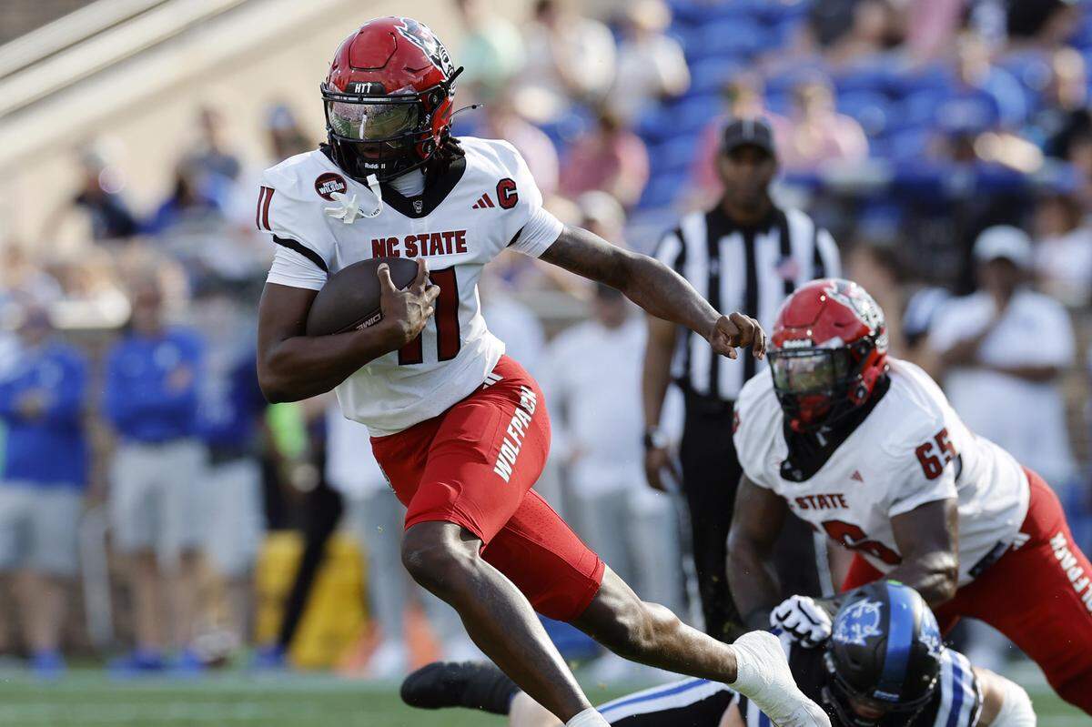 N.C. State quarterback CJ Bailey (11) scrambles for yards during the first half of N.C. State’s game against Duke at Wallace Wade Stadium in Durham, N.C., Sat. Sept. 20, 2025