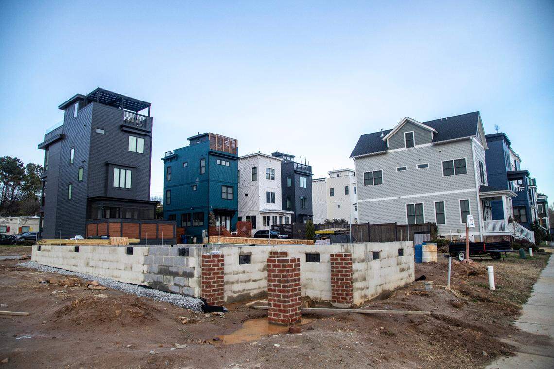 New residential buildings in the Carlaeigh neighborhood line Maywood Street near Dorothea Dix Park in Raleigh.
