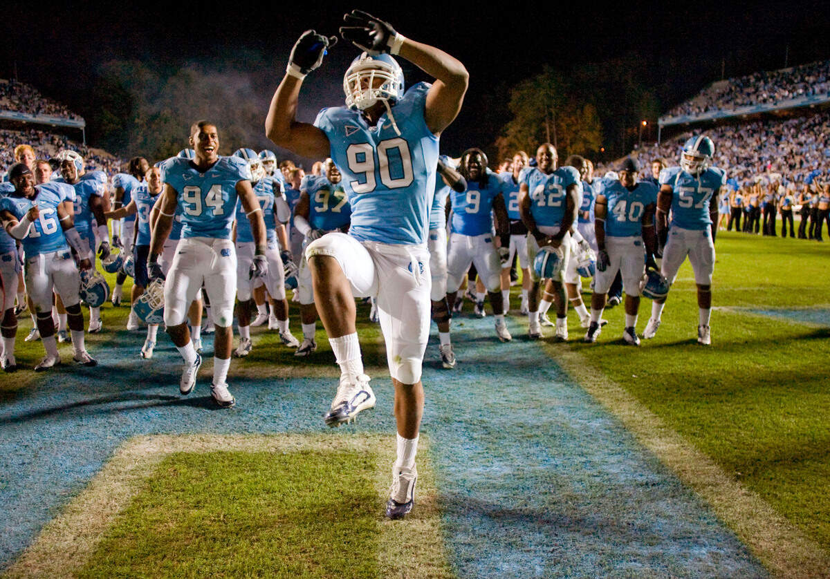 UNC’s Quinton Coples (90) does a victory dance in front of his teammates as they celebrate the Tar Heels’ 19-6 victory over Duke on Saturday November 7, 2009 at Kenan Stadium in Chapel Hill, N.C.. ROBERT WILLETT -robert.willett@newsobserver.com