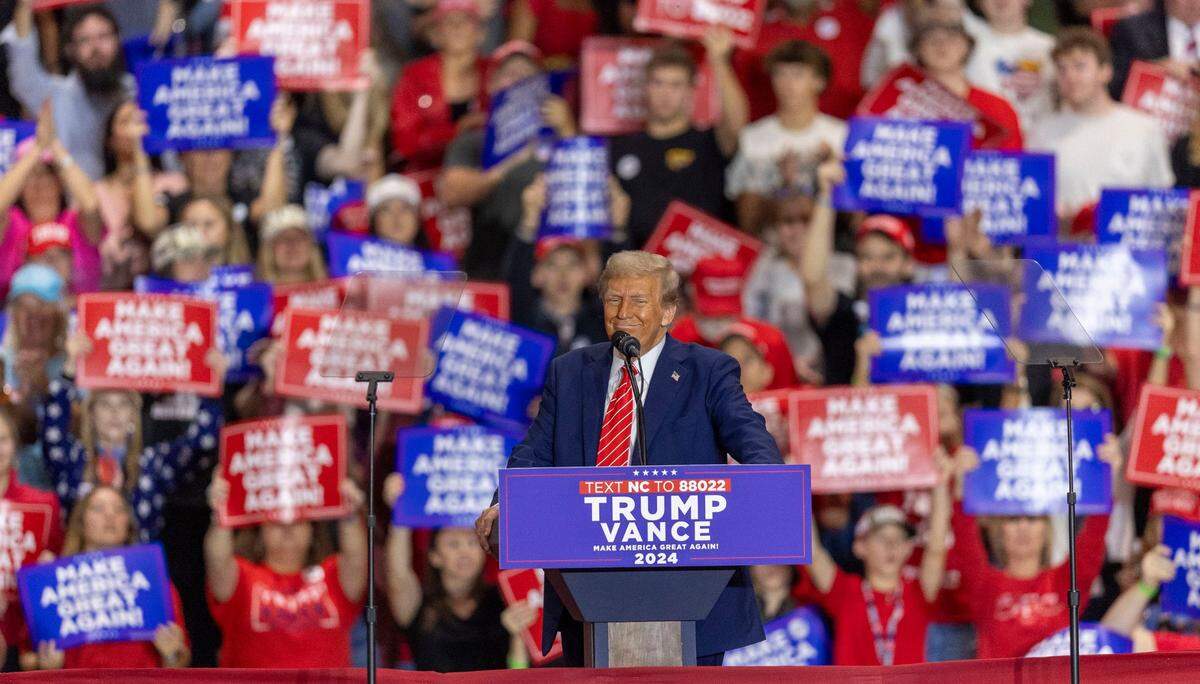 Former President Donald Trump, the Republican presidential nominee, smiles as he delivers his remarks to a packed house on Wednesday, October 30, 2024 at the Rocky Mount Event Center in Rocky Mount, N.C.