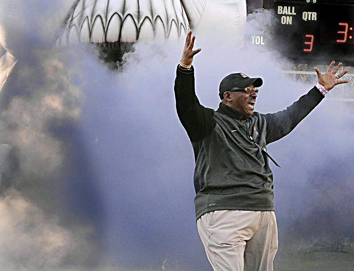 In this 2014 file photo, East Carolina head coach Ruffin McNeill gets the crowd to their feet during introductions before the Pirates’ game with Tulane at Dowdy-Ficklen Stadium in Greenville in November 2014.