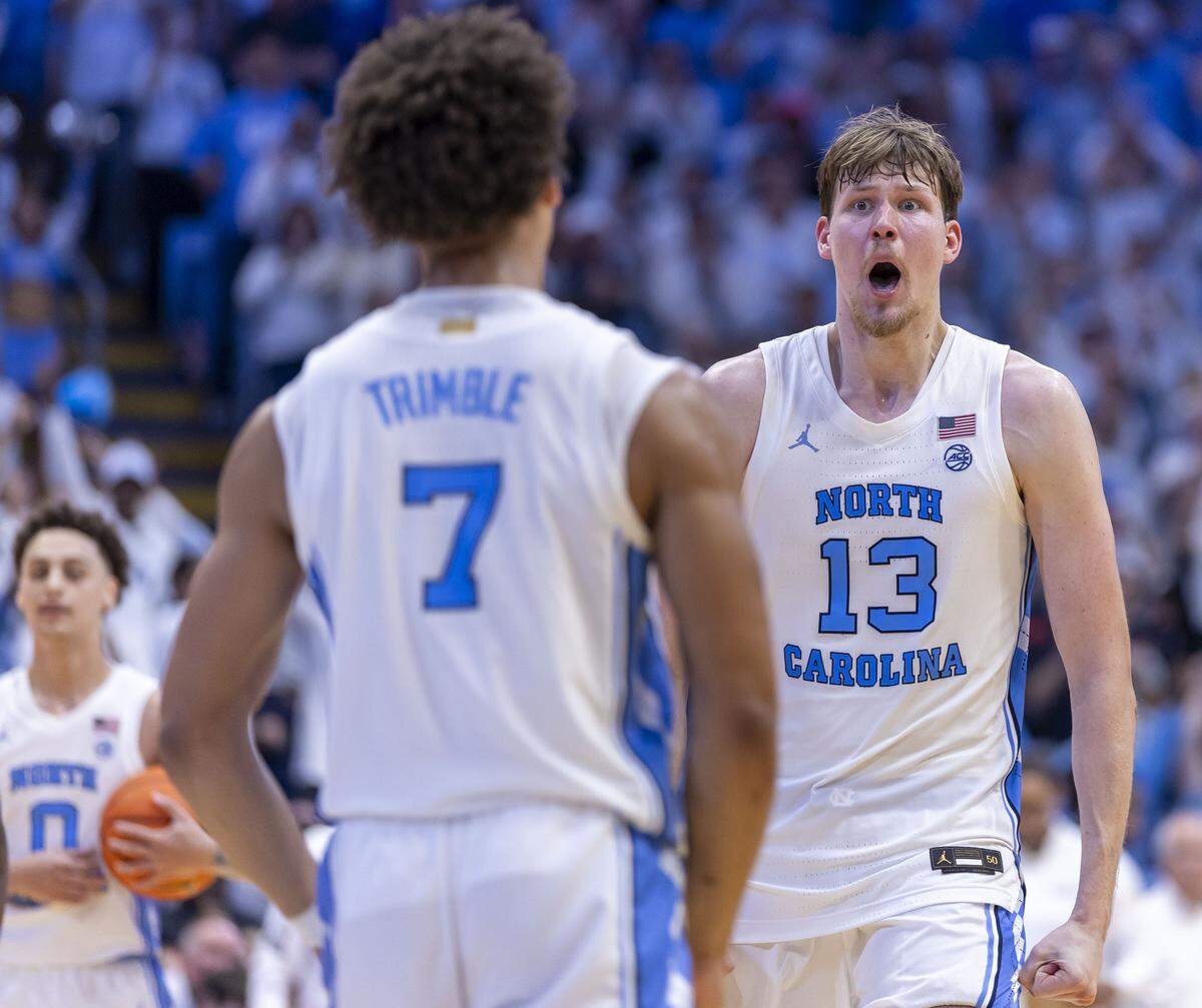 North Carolina center Henri Veesaar (13) and guard Seth Trimble (7) celebrate their 87-74 victory over Kansas on Friday, November 7, 2025 at the Smith Center in Chapel Hill, N.C.