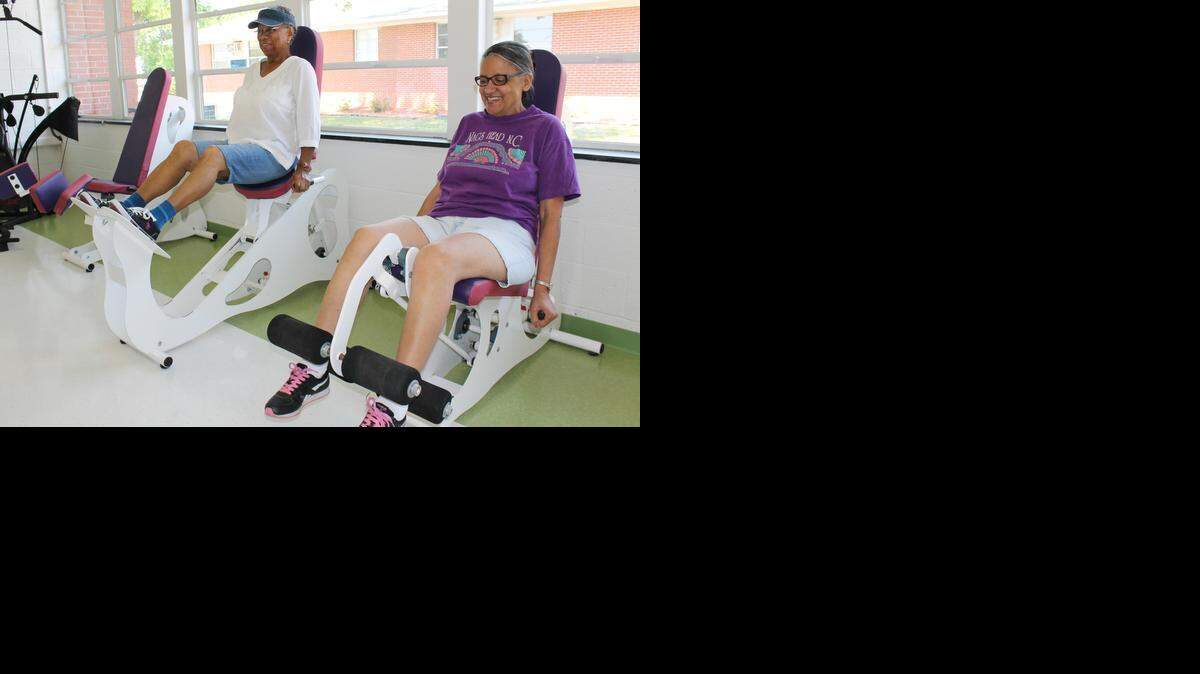 Jeffie Haskins, left, 77, and Rowena Sykes, 63, use new exercise equipment at the Harrison Center for Active Aging in Selma.
