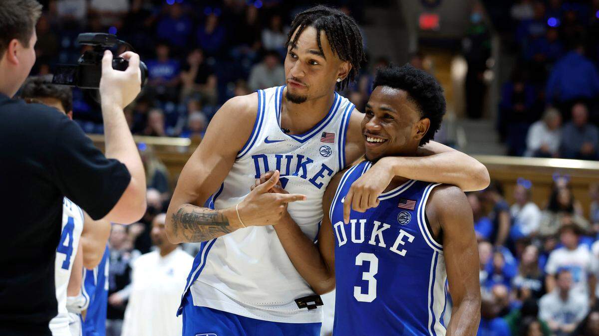 Duke’s Dereck Lively II laughs with Jeremy Roach (3) as they talk to the camera after the Blue-White scrimmage during Duke’s Countdown to Craziness at Cameron Indoor Stadium in Durham, N.C., Friday, Oct. 21, 2022. It will be impossible to fully judge Duke’s progress until Lively, who is out with a calf muscle strain, returns. He’s that talented.