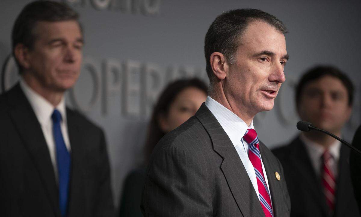 Eric Davis, chairman of the North Carolina State Board of Education addresses the closing of all schools in the state during a press briefing with Governor Roy Cooper on the COVID-19 virus on Saturday, March 14, 2020 in Raleigh, N.C. 