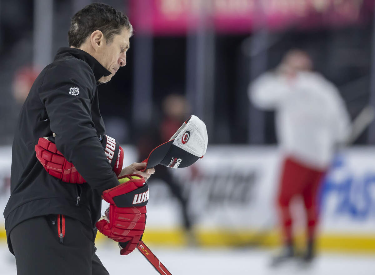 Carolina Hurricanes coach Rod Brind’Amour studies notes inside his cap, during practice ahead of Game 4 of the Stanley Cup Final, on Monday, June 8, 2026 at T-Mobile Arena in Las Vegas, NV