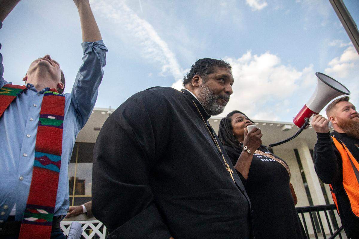 Rev. William J. Barber II leads a rally outside the North Carolina Legislative Building during a Moral Monday march and rally at the State Capitol and the state legislature Monday, April 24, 2023. Organizers of the Moral Monday protests that began in 2013 as a backlash against conservative state laws marked a decade of social activism Monday night.