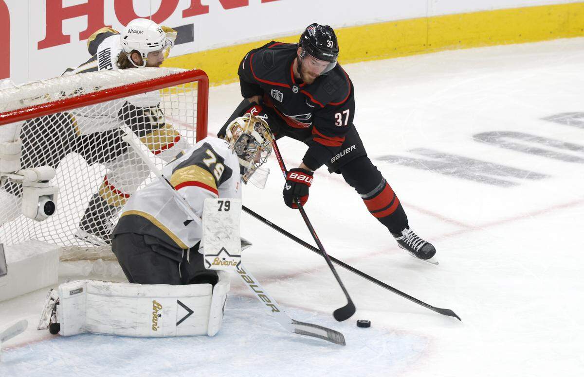 Carolina's Andrei Svechnikov (37) can’t get the puck past Vegas’ Carter Hart (79) in the first period of the Hurricanes’ game against the Golden Knights in the second game of the Stanley Cup Final at the Lenovo Center in Raleigh, N.C., Thursday, June 4, 2026.