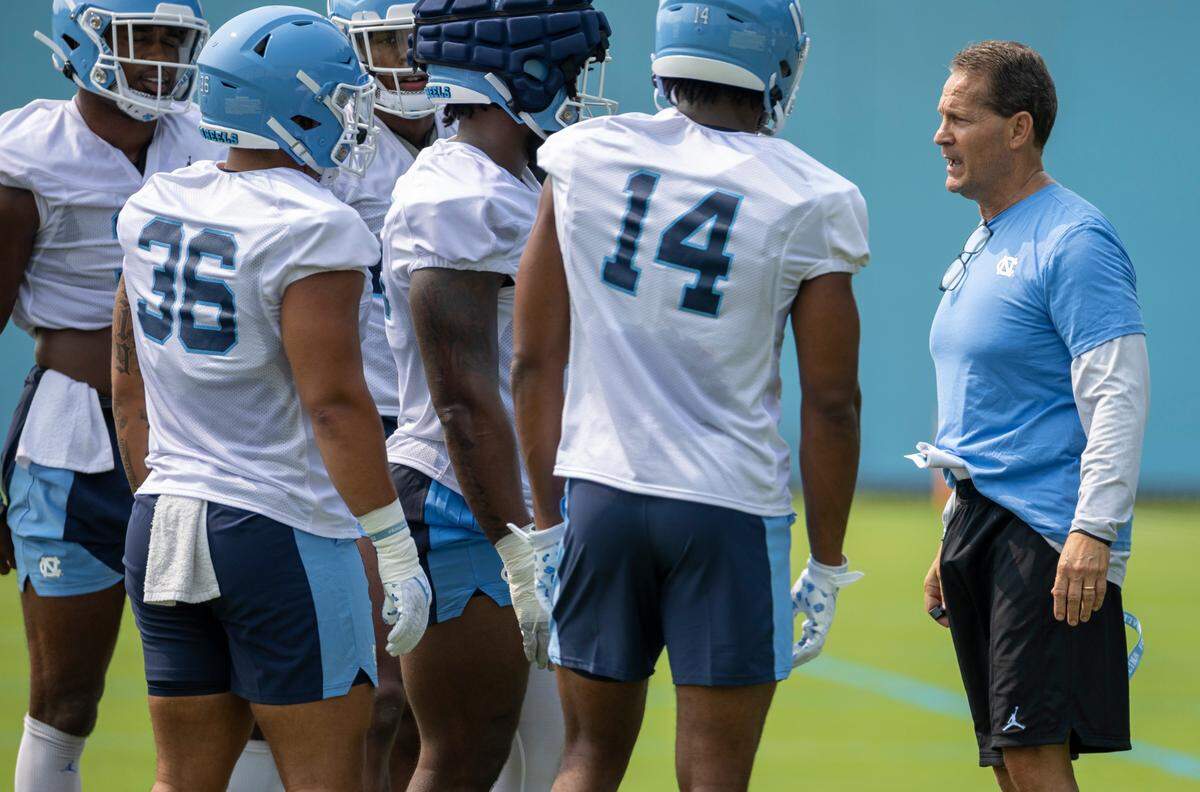 North Carolina assistant head coach for defensive Gene Chizik works with his players during the first day of practice on Wednesday, August 2, 2023 in Chapel Hill, N.C.