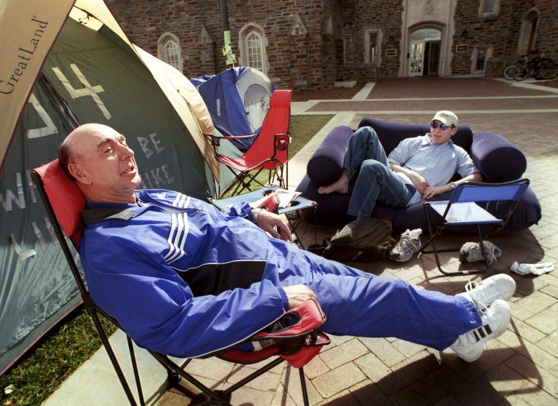 dickiev4.journal.030300.cll -- Dick Vitale takes a quick break with Jonathan Roth, sophomore, right, at the tent city known as Krzyzewskiville at Duke Univerisity the day before the last home game against UNC on March 4. Roth had been camping out for a seat at the game since Feb. 16.