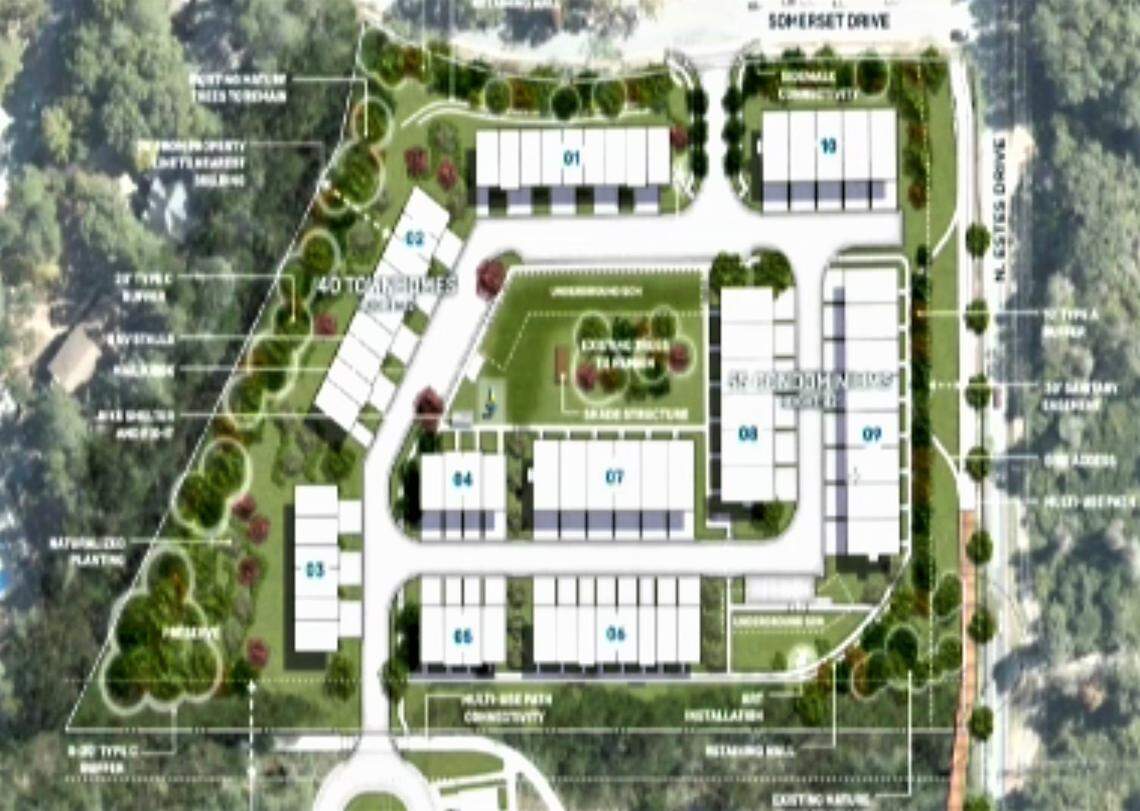 A revised site plan shows townhome and condo buildings located around a central courtyard and clubhouse on North Estes Drive in Chapel Hill. Estes Drive is to the right, and the upcoming Aura Chapel Hill project is off screen at the bottom.