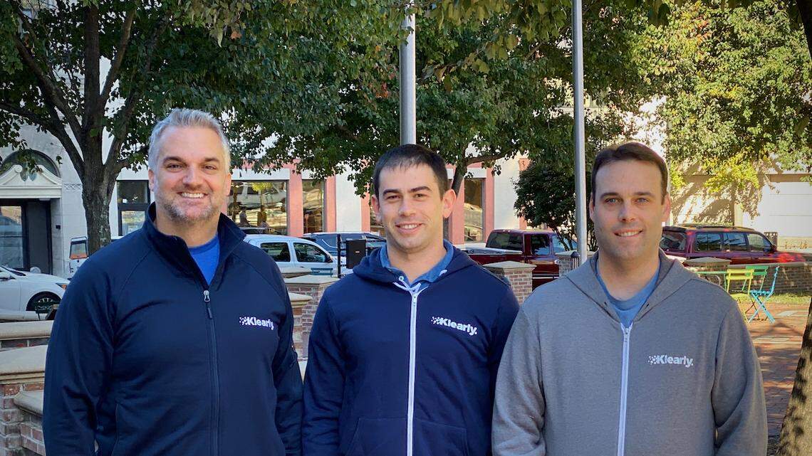Alex Krawchick, founder and CEO of Klearly, left, stands with employees Brad Rubin, middle, and Erif Pfahl, right, in downtown Durham.