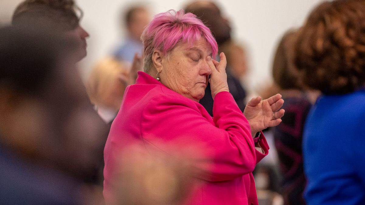 Rep. Allison Dahle of Wake County wipes a tear from her eye as the N.C. House of Representatives honors the late Rep. Joe John on Wednesday, January 29, 2025 in Raleigh, N.C.