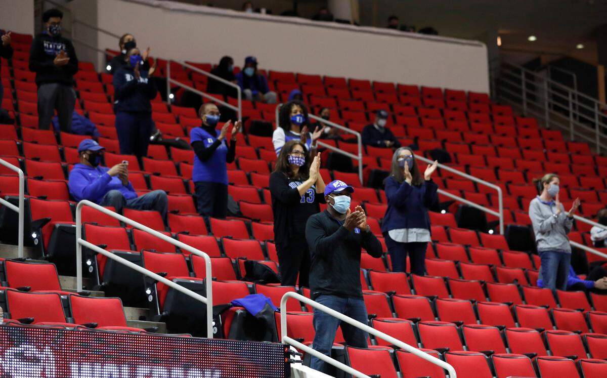 Duke fans cheer on the team before N.C. State’s game against Duke at PNC Arena in Raleigh, N.C., Saturday, February 13, 2021.