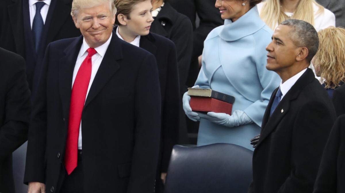 President-elect Donald Trump looks over at President Barack Obama before being sworn in as the 45th president of the United States during the 58th Presidential Inauguration at the U.S. Capitol in Washington, Friday, Jan. 20, 2017.