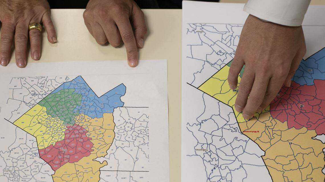 Legislative staff look over redistricting maps during a House committee meeting on Thursday, September 12, 2019 at the Legislative Office Building in Raleigh, N.C.