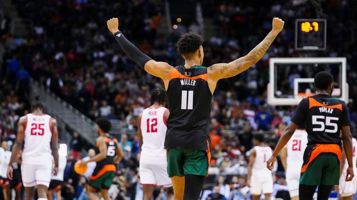 Miami Hurricanes guard Jordan Miller (11) celebrates during the final seconds of their 89-75 victory against the Houston Cougars in an NCAA tournament Midwest Regional semifinal at T-Mobile Center.