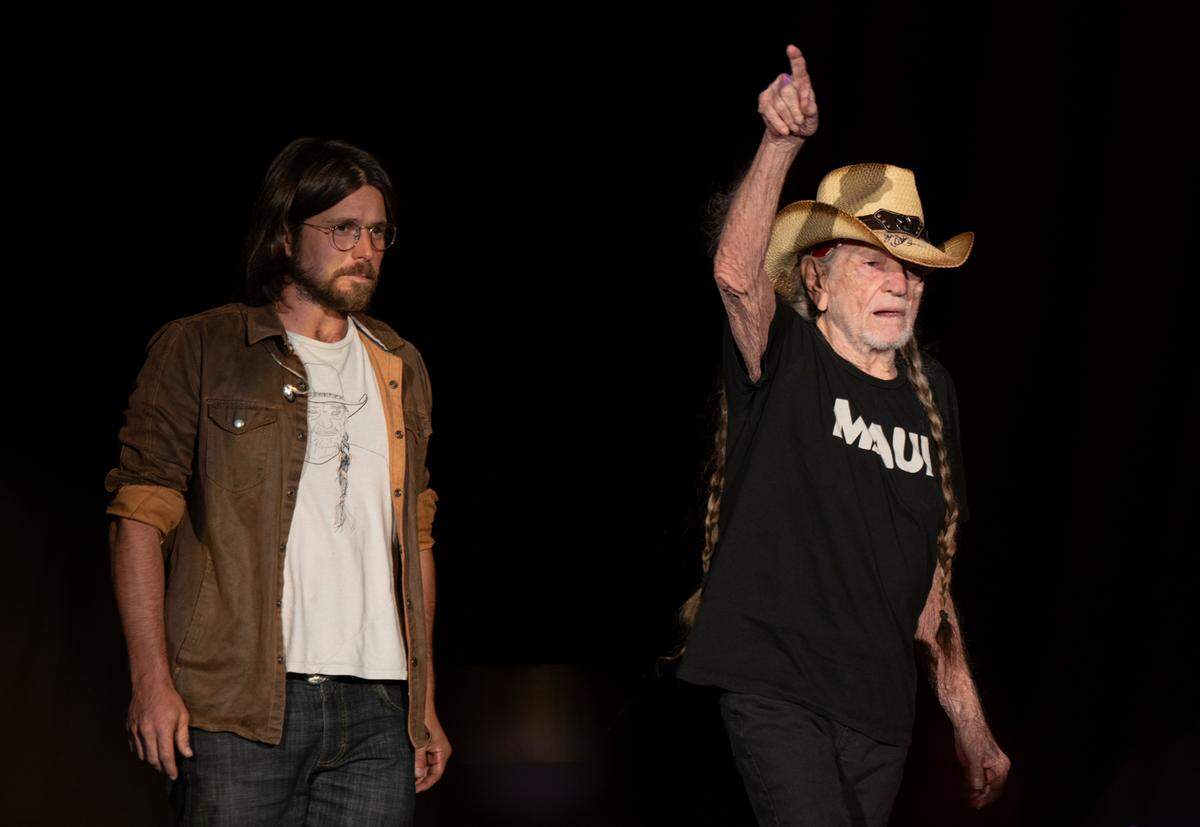Willie Nelson acknowledges the crowd as he takes the stage on the Outlaw Music Festival tour stop at Raleigh, N.C.’s Coastal Credit Union Music Park, Friday night, Sept. 8, 2023.