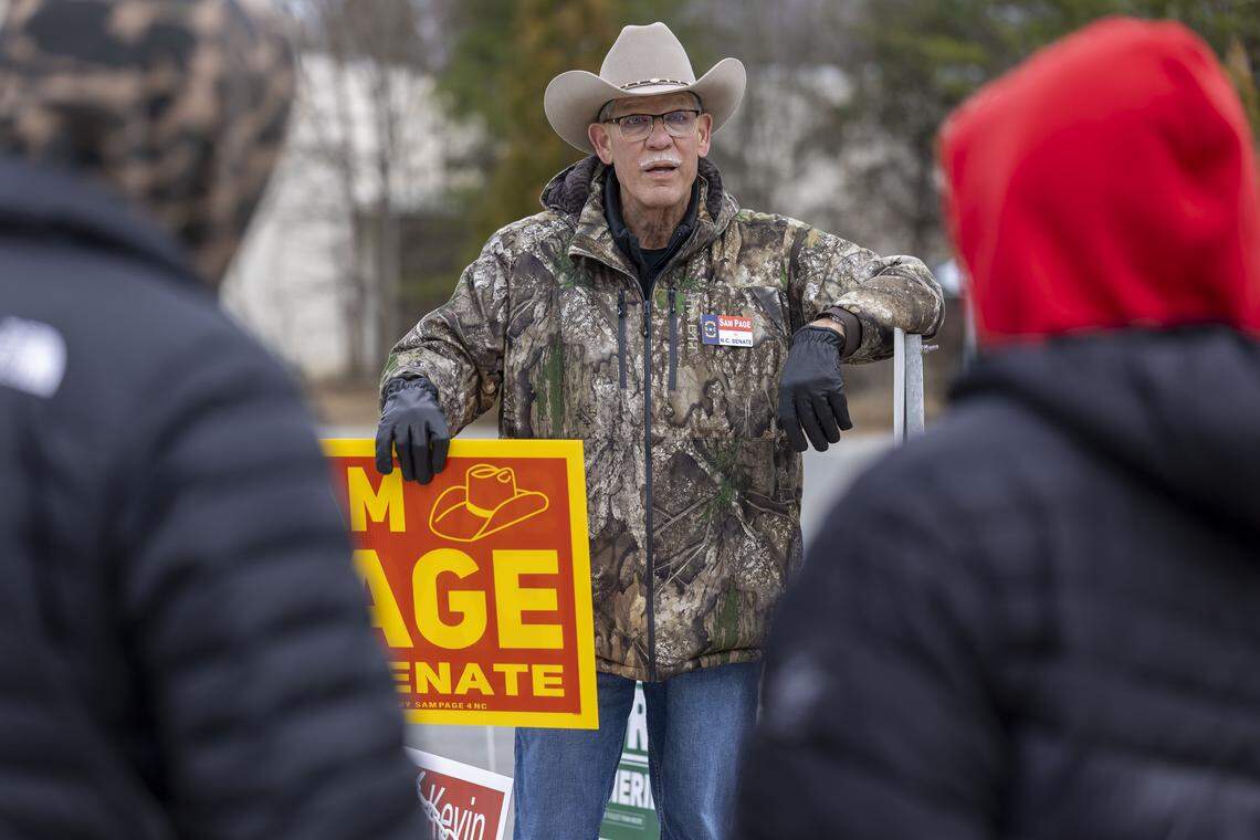 Rockingham County Sheriff  Sam Page, candidate for NC Senate, talks with poll workers outside the Madison-Mayodan Public Library polling site on Tuesday, February 24, 2026. Page is challenging NC Senator Phil Berger in the primary. 
