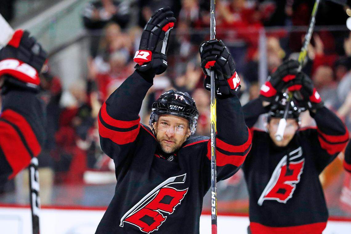 Carolina Hurricanes’ Justin Williams (14) participates in the post game celebration following the Hurricanes 2-1 win over the New York Islanders at an NHL hockey game in Raleigh, N.C., Sunday, Jan. 19, 2020.