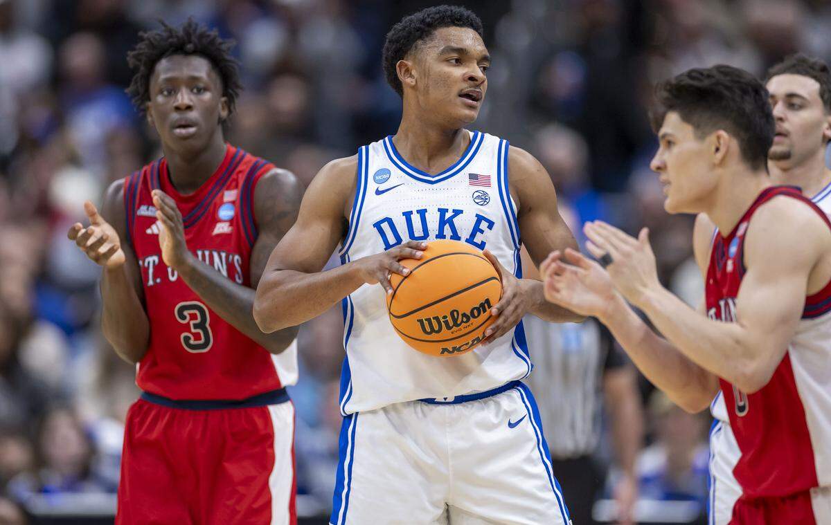 Duke guard Caleb Foster (1) reacts after turning the ball over on a backcourt violation in the second half against St. John’s on Friday, March 27, 2026, during the Sweet Sixteen of the NCAA Tournament at Capital One Arena in Washington, D.C.