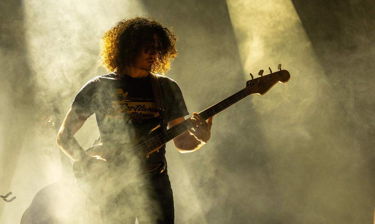 Craig Burletic on bass guitar takes the stage as Tyler Childers plays Raleigh, N.C.’s Coastal Credit Union Music Park at Walnut Creek, Wednesday night, April 23, 2025.