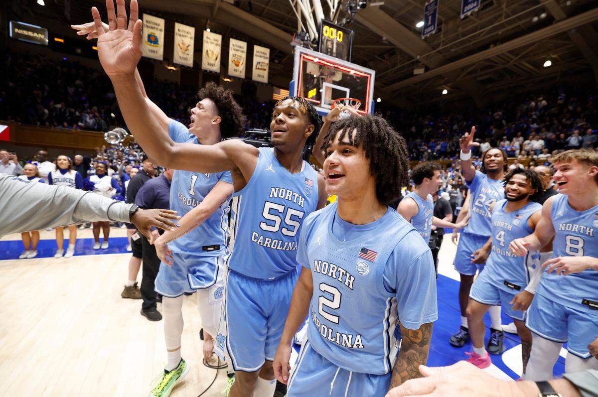 North Carolina’s Harrison Ingram (55) and North Carolina’s Elliot Cadeau (2) motion to the Cameron Crazies after UNC’s 84-79 victory over Duke at Cameron Indoor Stadium in Durham, N.C., Saturday, March 9, 2024.